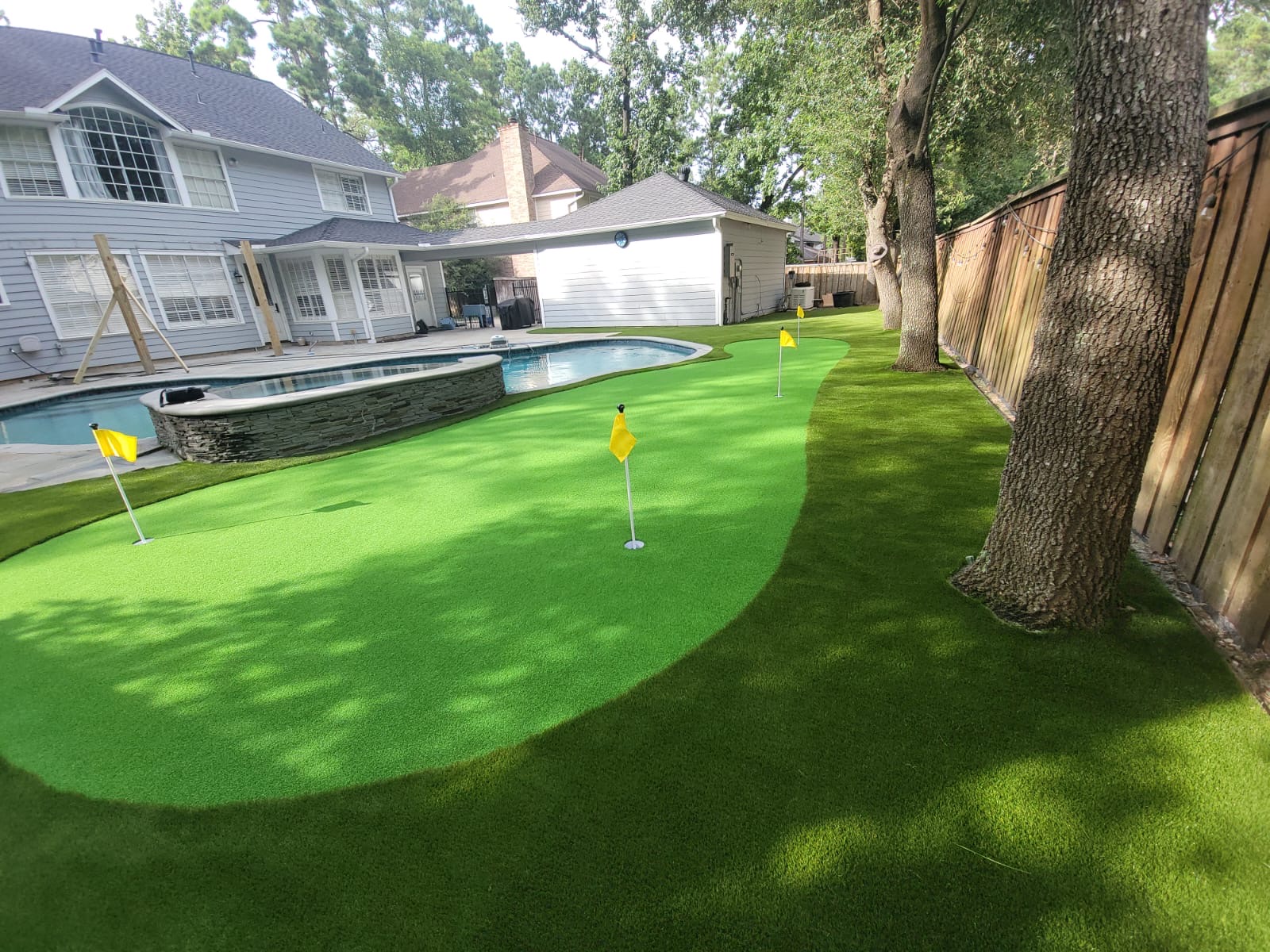 Poolside backyard putting green